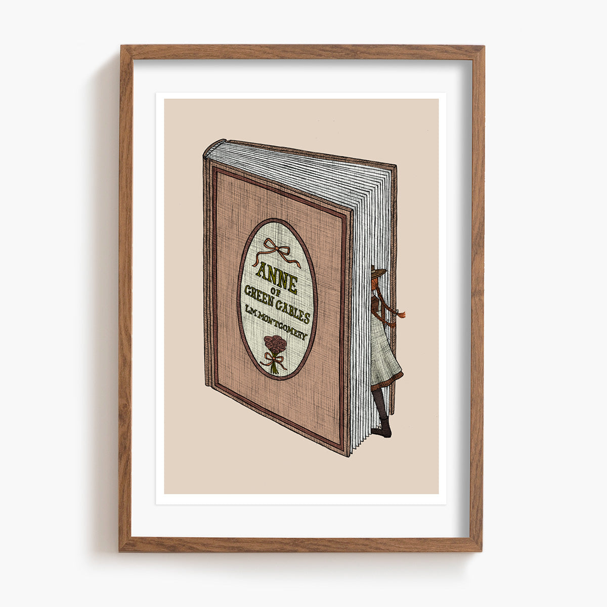 Framed artwork of an Anne of Green Gables book with a decorative cover on a beige background.