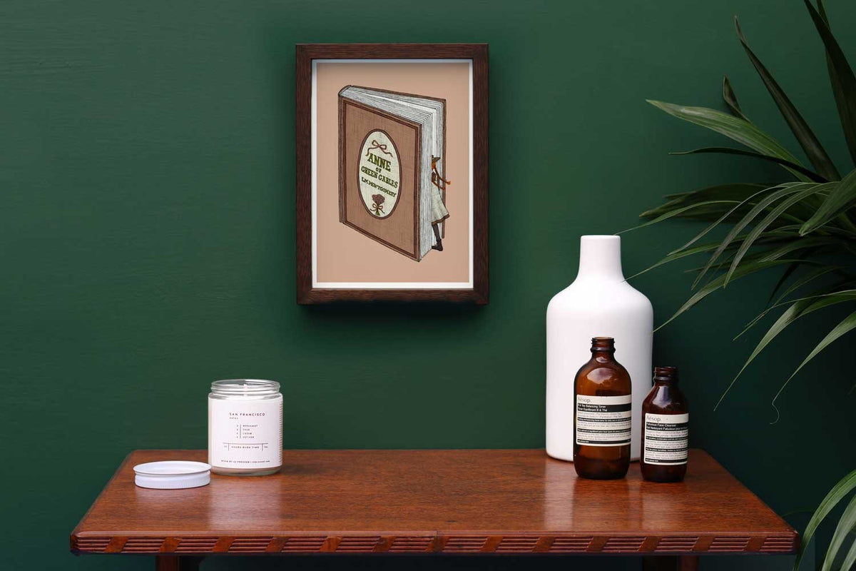 Anne of Green Gables illustration framed on a green wall