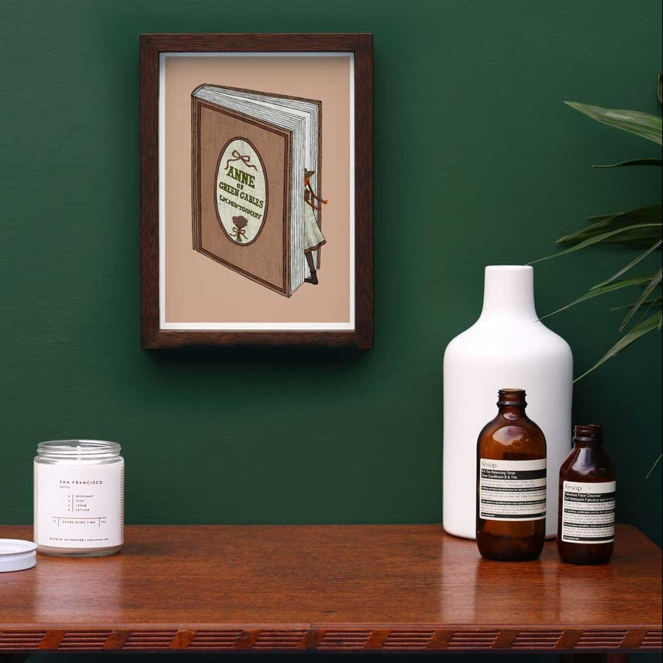 Anne of Green Gables illustration framed on a green wall