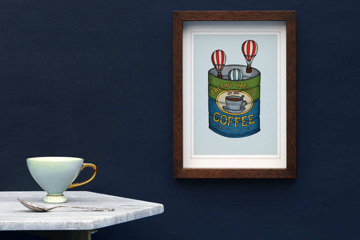 Coffee tin art print famed on a blue wall