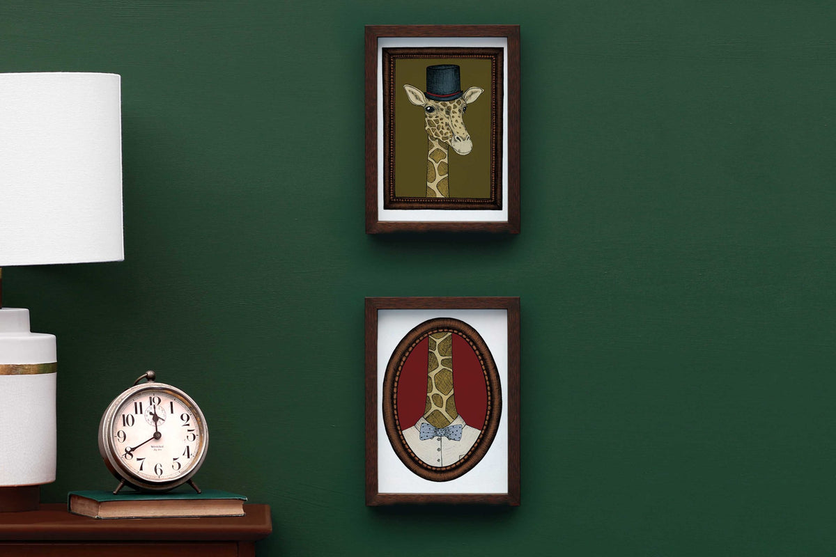 Gerald the giraffe artwork in a frame on a green wall