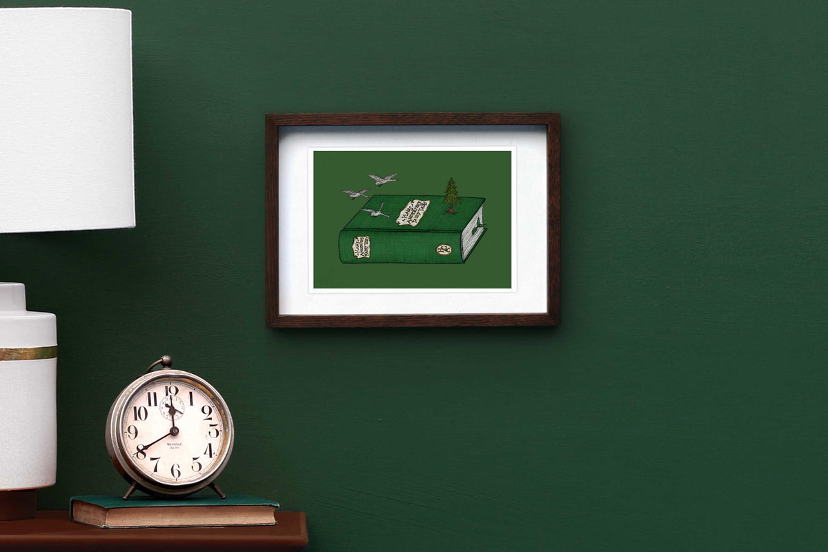 Hans Christian Andersen artwork framed on a green wall