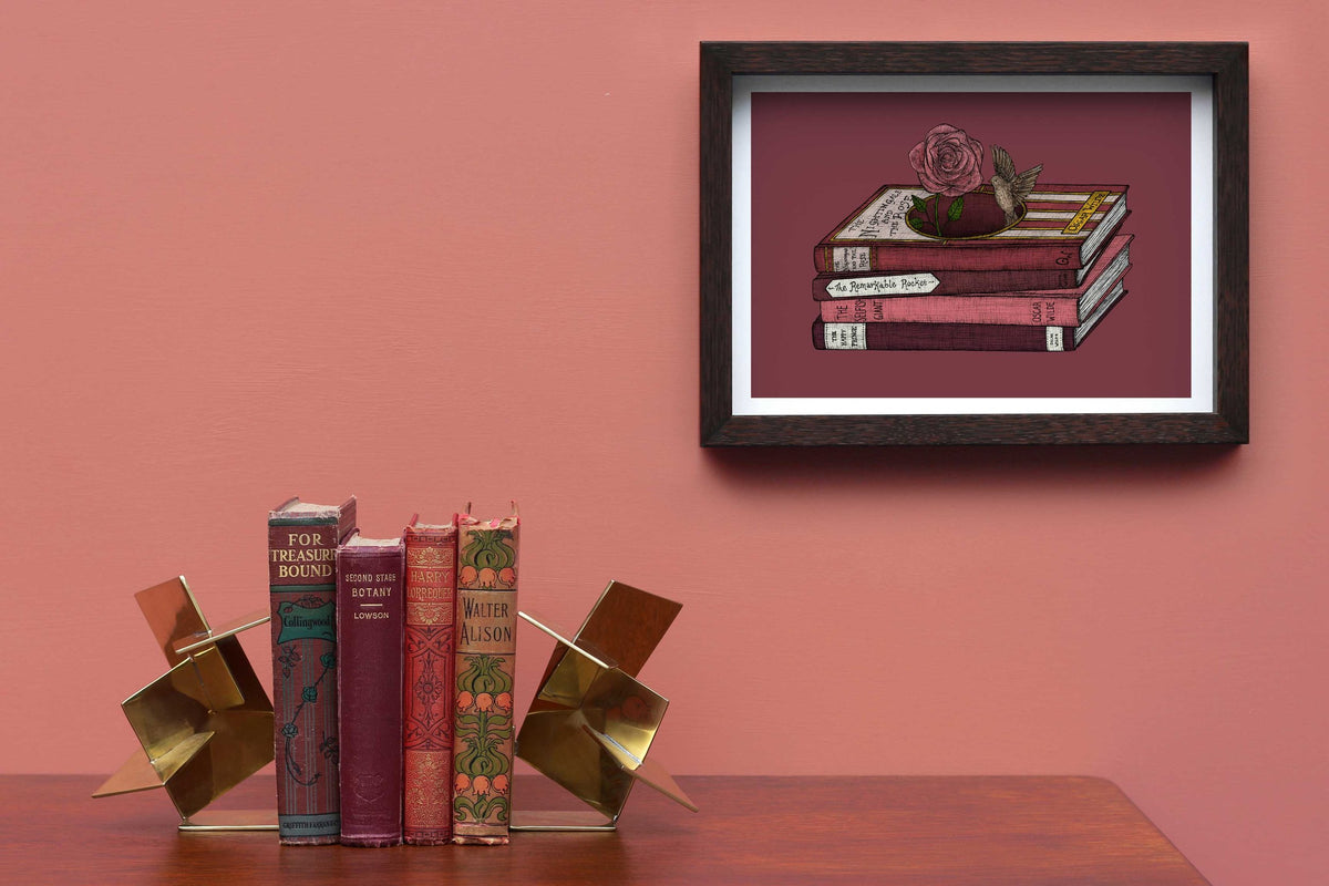 Oscar Wilde art print framed on a pink wall