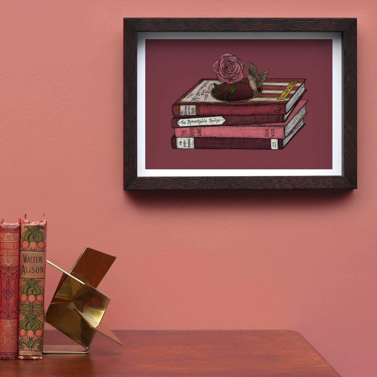 Oscar Wilde art print framed on a pink wall