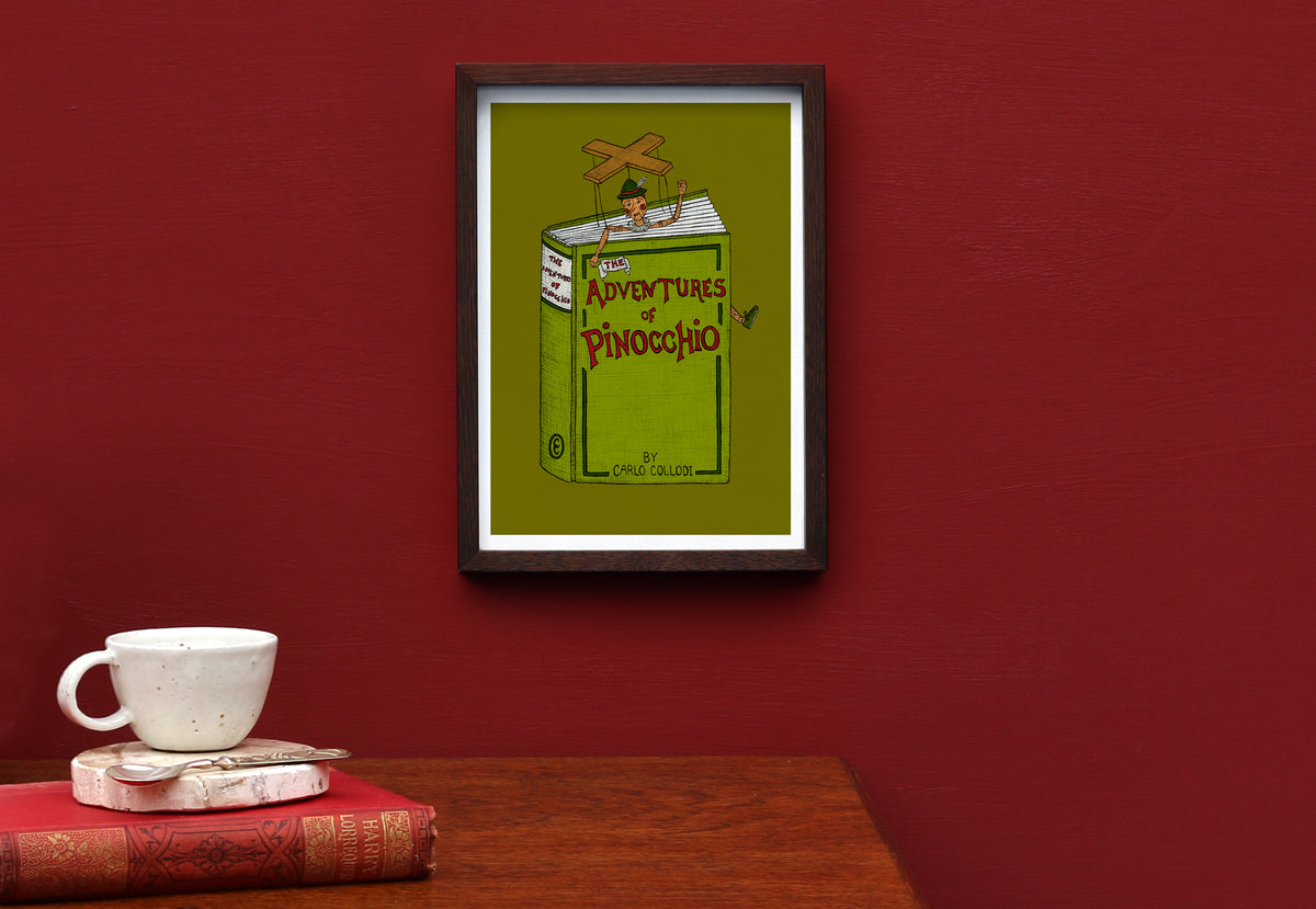 Pinocchio art print framed on a red wall