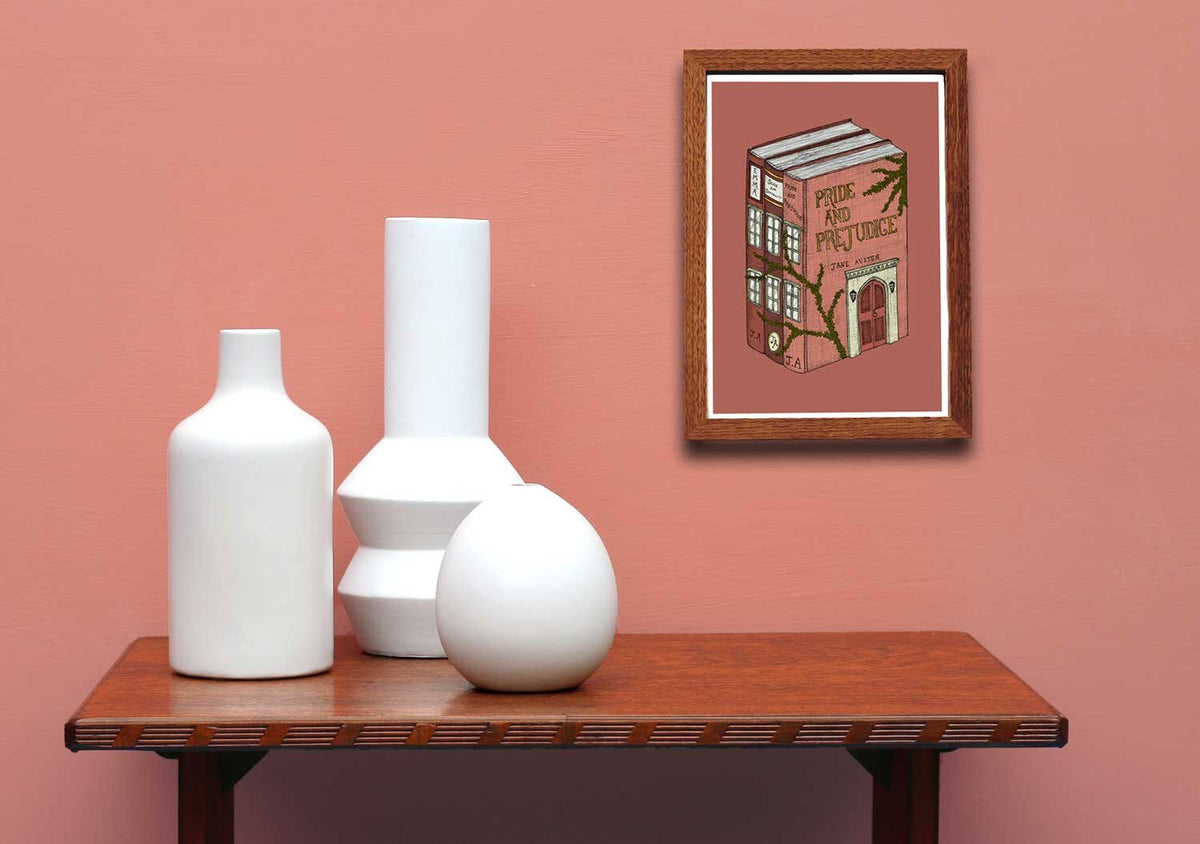 Pride and Prejudice art framed on a pink wall