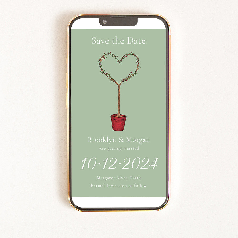 A digital invitation displayed on a smartphone with a green background, featuring a heart-shaped plant and text that reads 'Save the Date'.