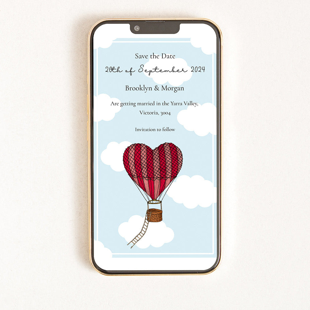 A digital invitation displayed on a smart phone with a balloon and heart design, indicating a 'Save the Date' message for an event.