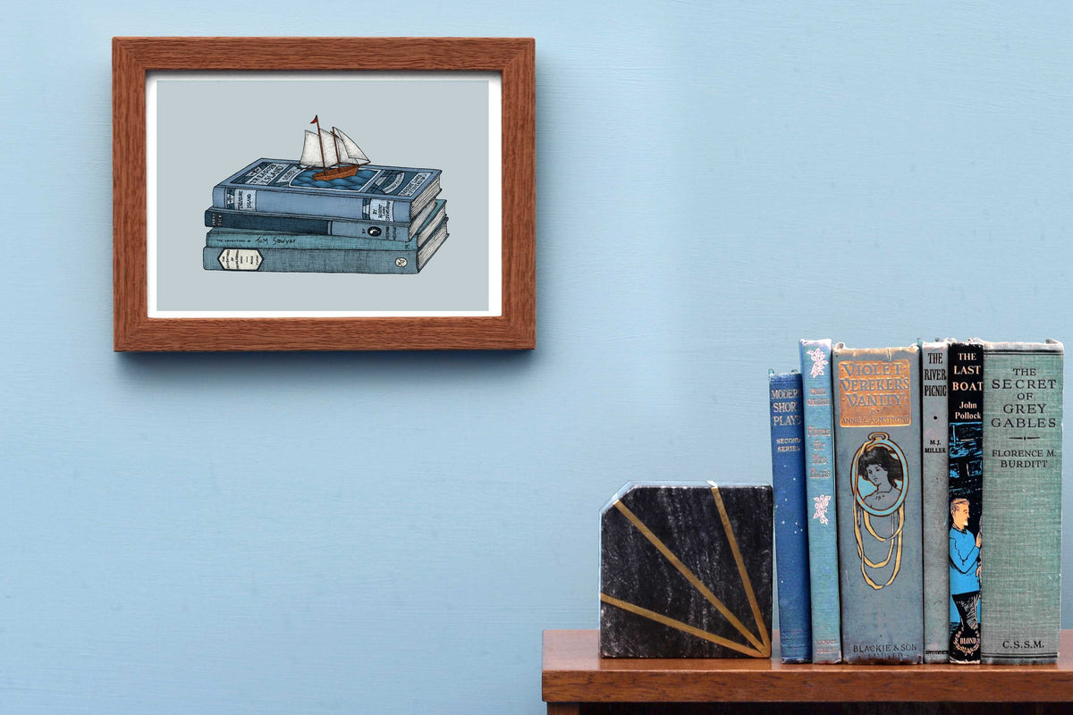 Treasure Island art print framed on a blue wall