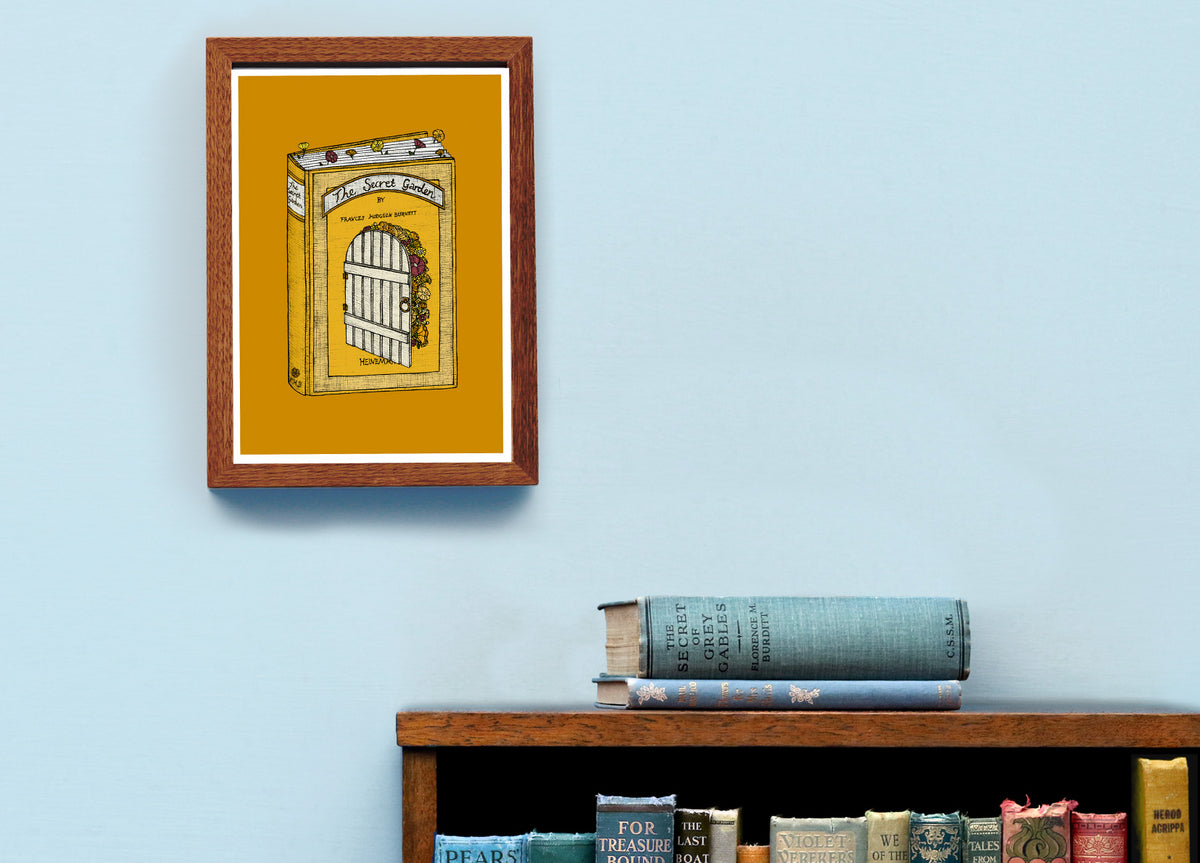 The Secret Garden art framed on a blue wall