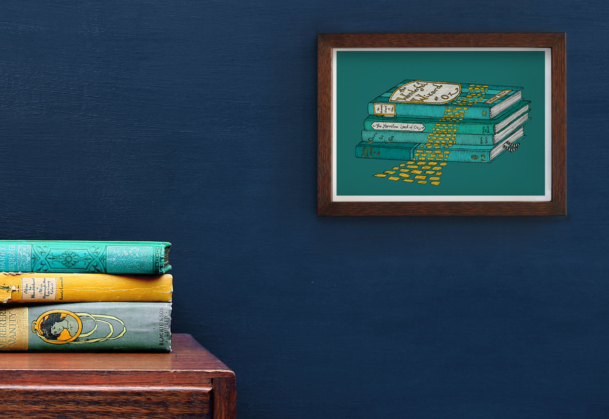 The Wizard of Oz art print framed on a blue wall