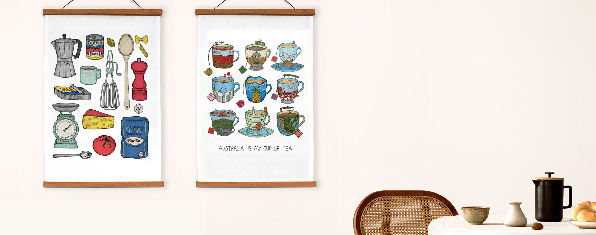 Quirky Art Tea Towels nicely framed hanging on a whilte wall