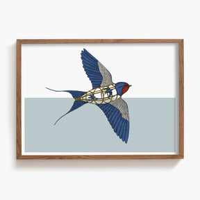 Framed artwork of a swallow with a cage inside on a light blue background