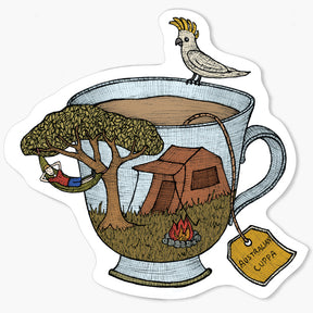 Illustration of a teacup with a camping scene inside, including a tree, tent, and fire, with a cockatoo on top.