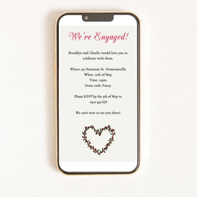 A digital invitation displayed on a smartphone with a heart illustration including details about an engagement party.