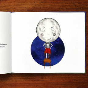 Illustration of a Mr.Moon with a face sitting on a chair against a starry background, inside an open book.