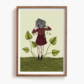 Framed artwork of a person holding a house over their face, standing on vines with leaves.