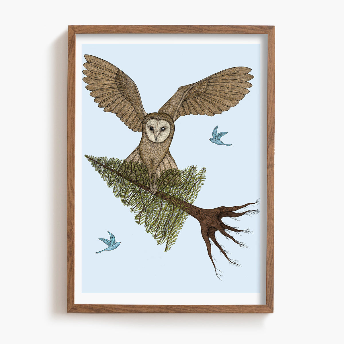 Framed artwork of an owl on a branch with a blue sky background