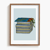 Framed artwork of a stack of peppermint tines with decorative flowers on a light blue background