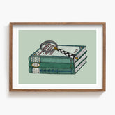 Framed artwork of a stack of a Sherlock Holmes books with a magnifying glass on a light green background