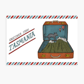 Illustration of an open suitcase with a mountain and Tasmanian devil, featuring 'Greetings from Tasmania' text.