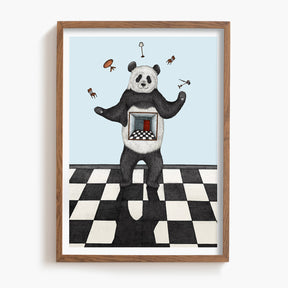 Framed artwork of a panda juggling on a checkered floor with a light blue background