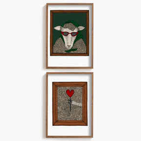Two framed artworks with a stylish sheep on a white background