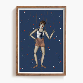 Framed artwork of a marionette against a blue background with red and white dots.