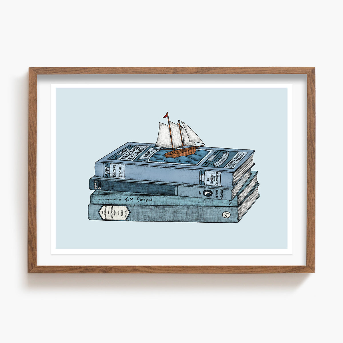 Framed artwork of a Treasure Island book with a sailboat on stacked books against a light blue background