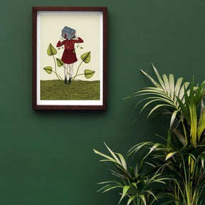 art print of a girl holding a house in a frame on a green wall