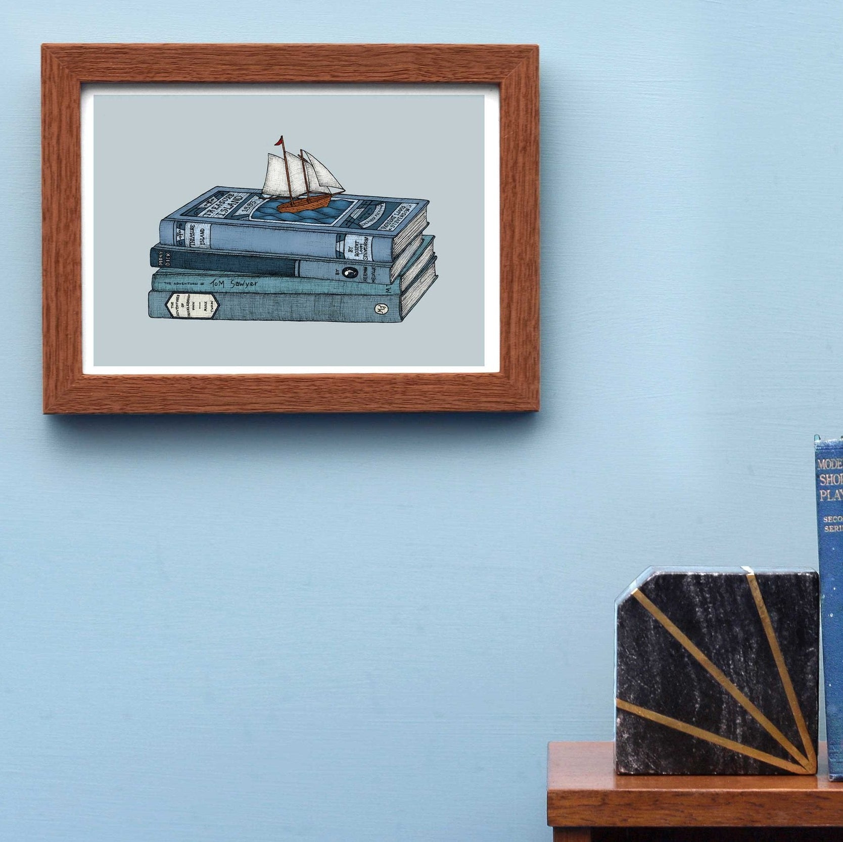 Treasure Island art print framed on a blue wall